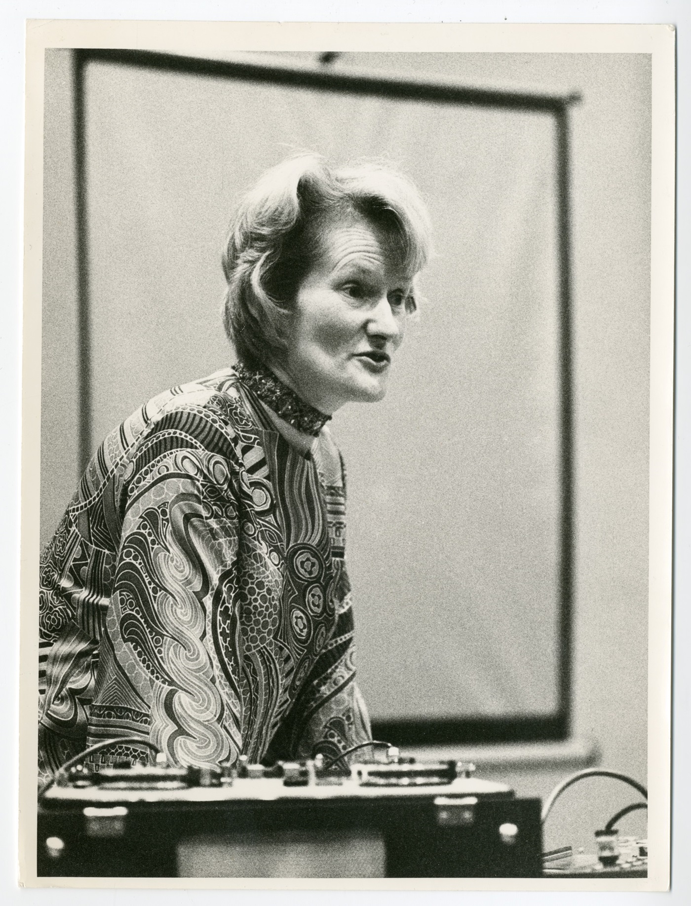 A photo of Daphne Oram speaking to an audience.